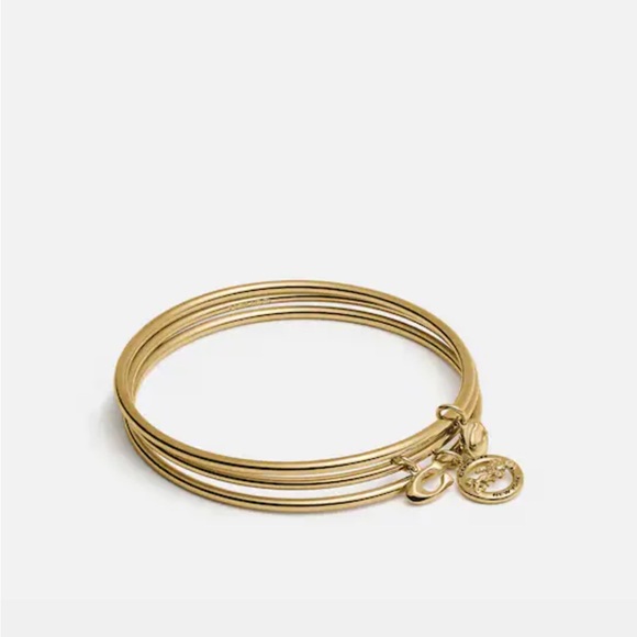 Coach gold Horse And Carriage Bangle Set,nwt .